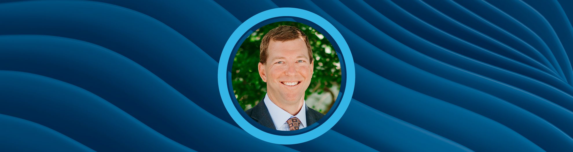 Image of Erik Melville with an abstract wavey blue background