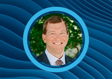 Image of Erik Melville with an abstract wavey blue background